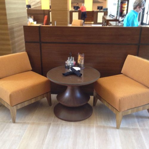 A couple of chairs in front of a table.