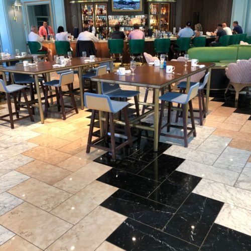 A restaurant with tables and chairs in it