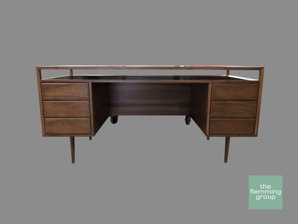 A desk with two drawers and one large open compartment.