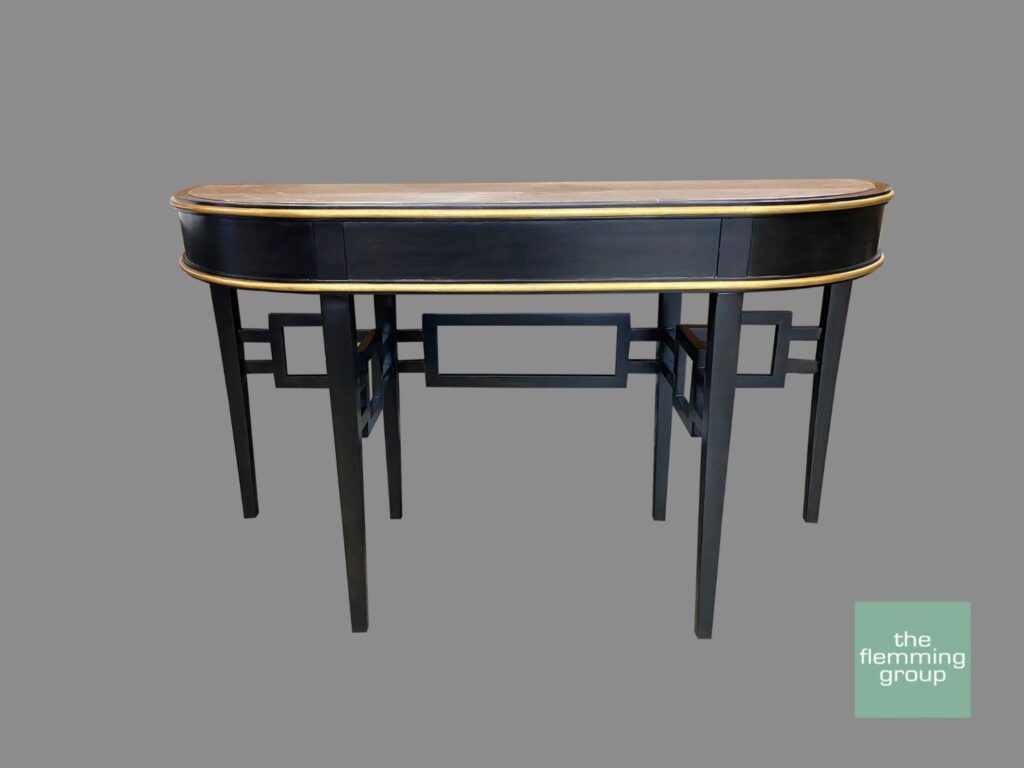 A black and gold desk with two drawers.