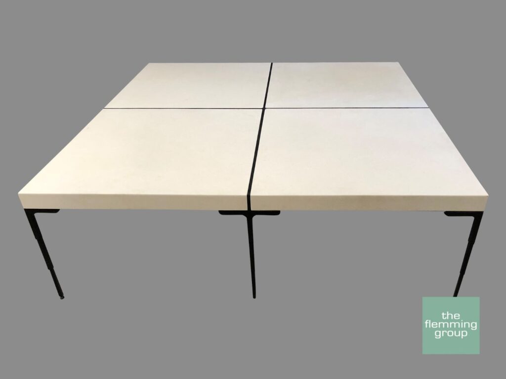 A table with four different sized squares on top of it.