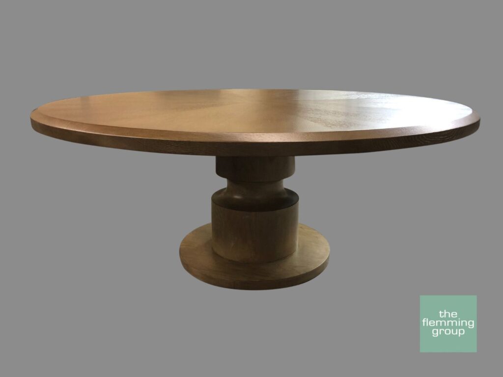 A round table with a pedestal base.