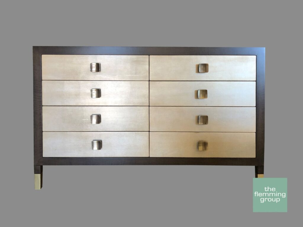 A dresser with eight drawers and two tone finish.