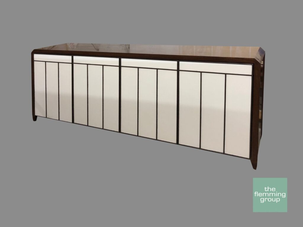 A large white cabinet with a brown frame.