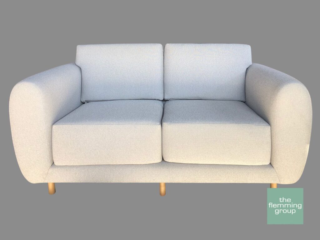 A couch with two pillows on it