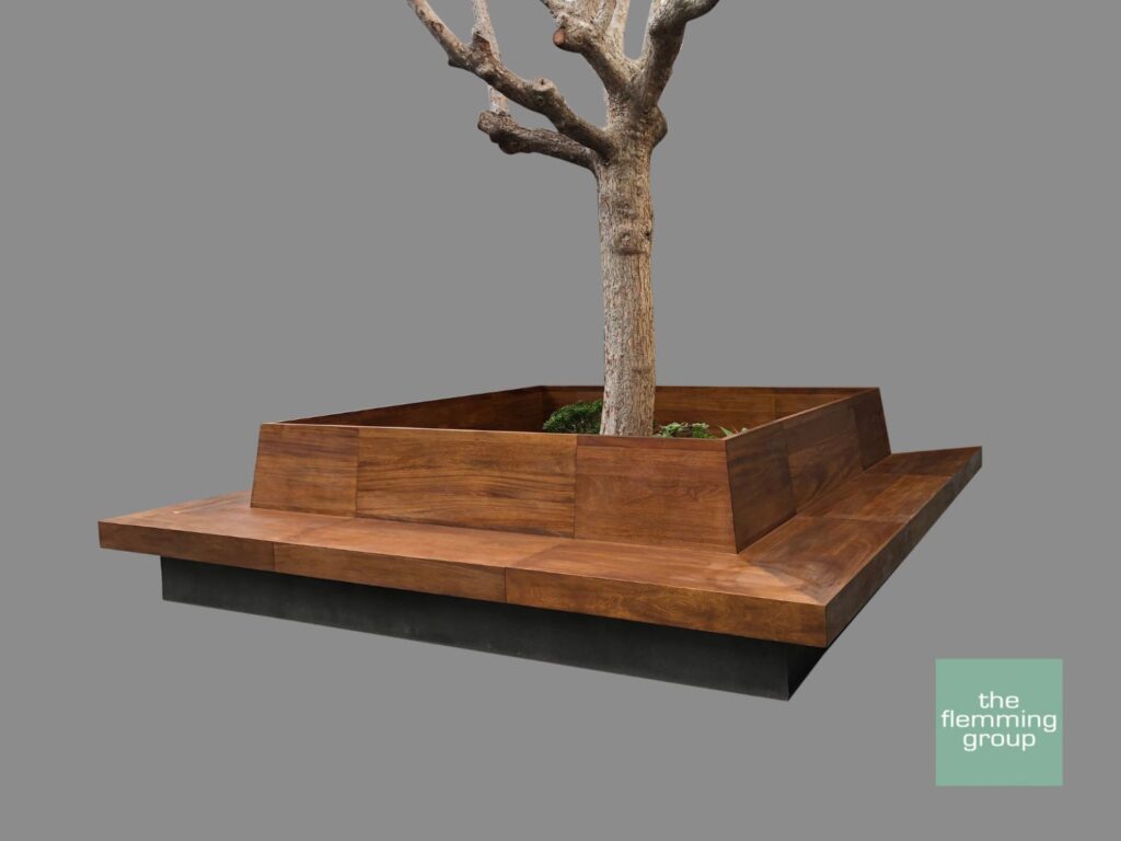 A tree in a planter on top of a table.