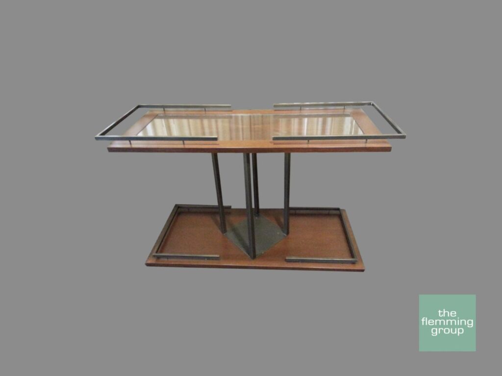 A table with two glass tables on top of it.