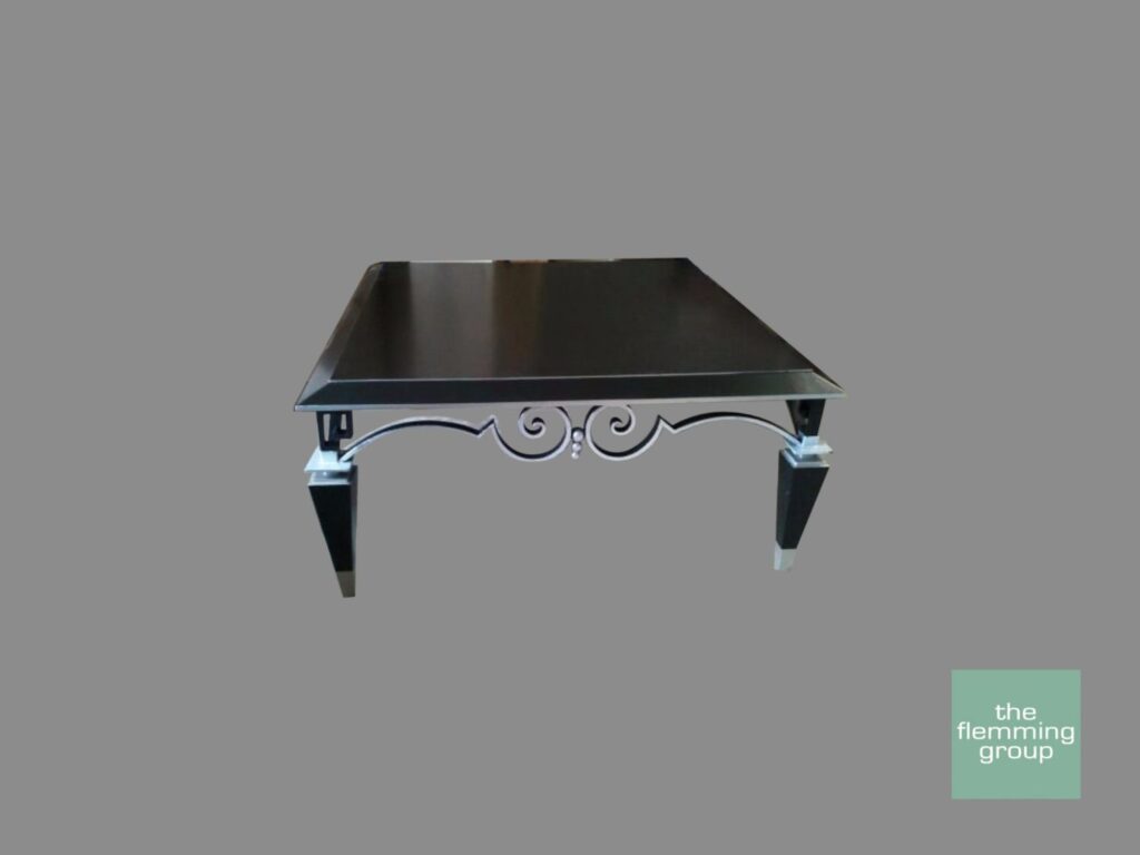 A black table with silver legs and metal accents.