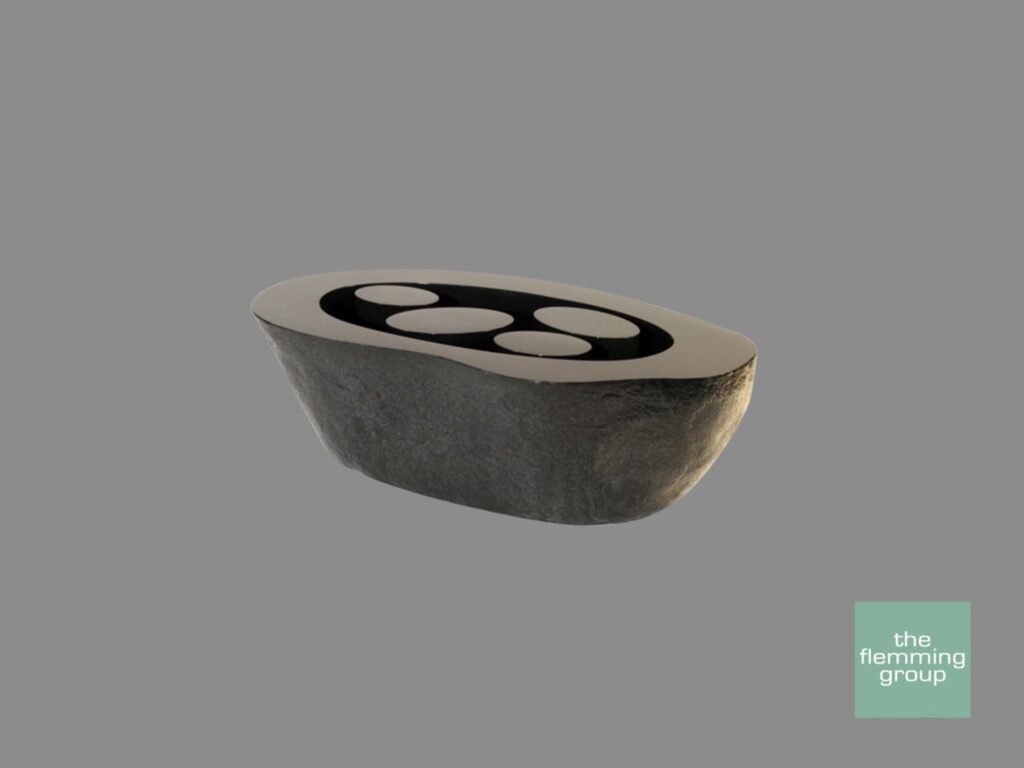 A concrete bowl with four holes in it.