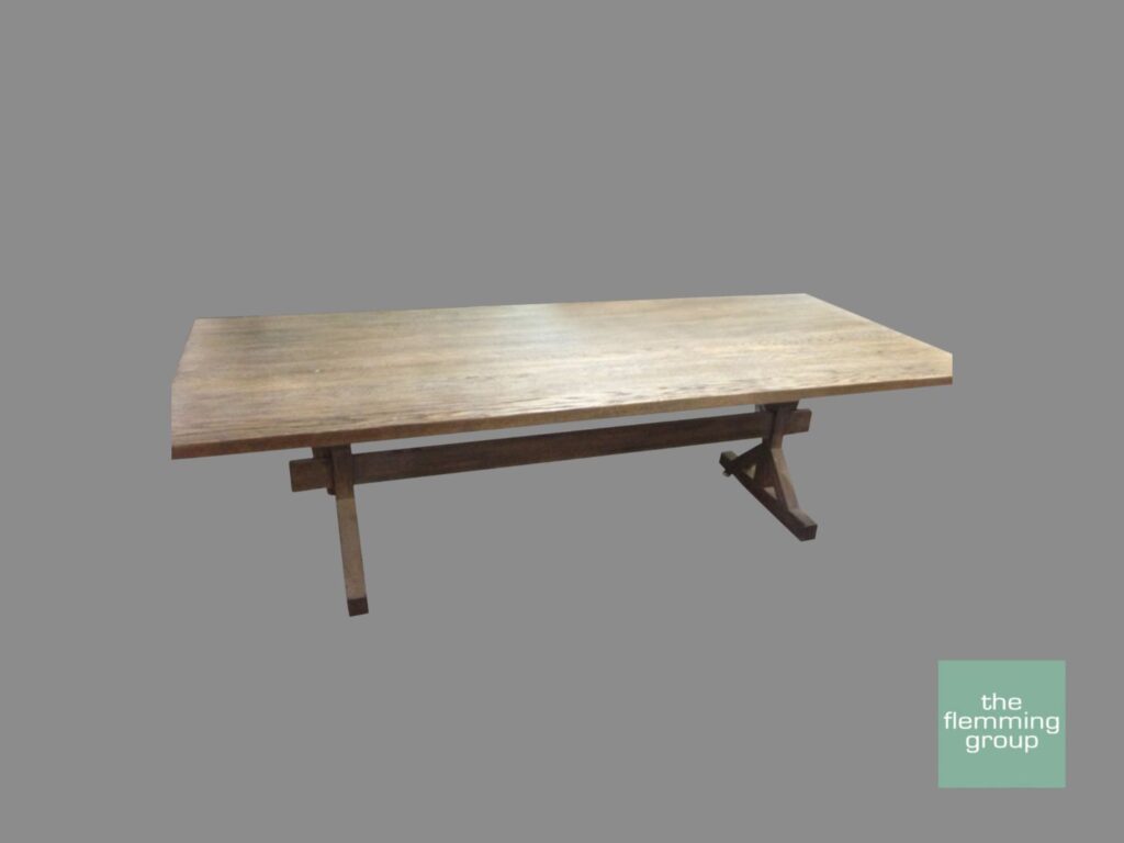 A wooden table with a metal base on top of it.