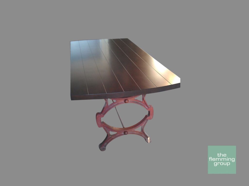 A table with a red base and wooden top.