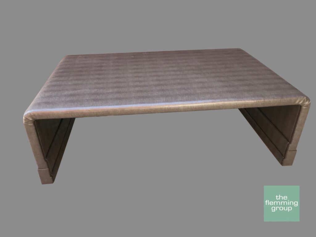A wooden table with a gray background