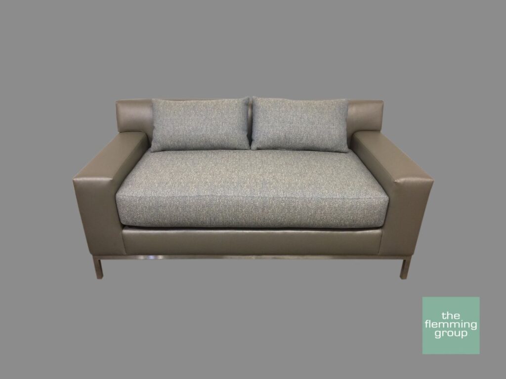 A couch with two pillows on it