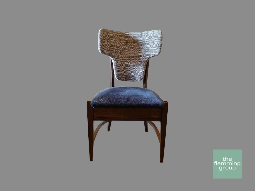 A chair with a blue seat and wooden back.