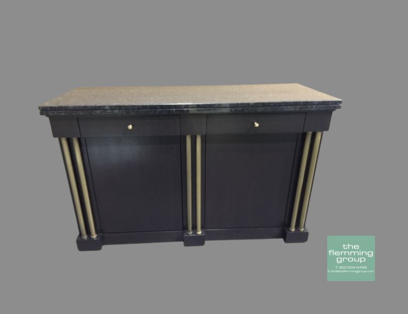 A black and gold cabinet with two drawers.