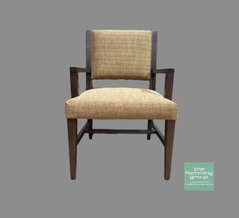 A chair with arms and beige fabric on the back.