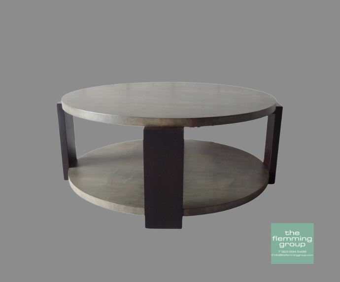 A round coffee table with two shelves and a black base.
